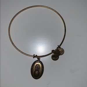 Alex and Ani bracelet with a pineapple on it.